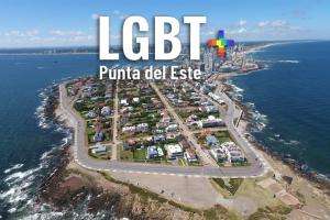 IDM y Municipio de PDE adhieren al día del orgullo LGBT iluminando La Mano con los colores de la diversidad
